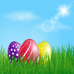 Three colorful Easter Eggs in the grass on sunny sky background. Vector illustration.