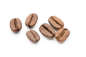 Naklejka premium Coffee beans isolated on white background, closeup, macro