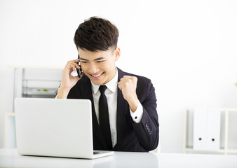 happy young  businessman working in office