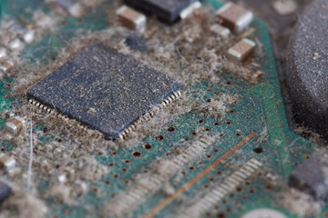 dusty circuit board in a hard drive - series of computer parts