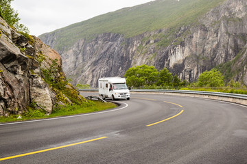 Campervan driving on Hardangervidda road in Norway