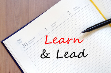 Learn & Lead write on notebook
