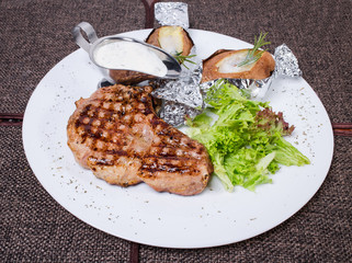 Delicious beef steak with roasted potatoes.