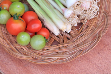 Basket filled with vegetables for cooking.