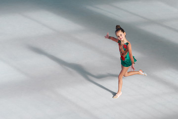  girl gymnast performs dance in gymnastics