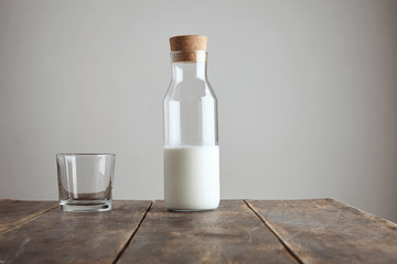 Bottle with milk near rox isolated on table