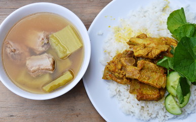 curry pork bone on rice eat with bitter cucumber boiled soup