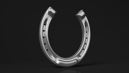 Silver horseshoe, isolated on black background.