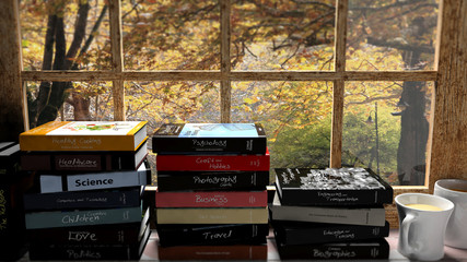 Stacks of books set on window with two coffee cups and autumn view with trees.