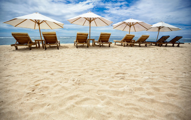 Sunbeds on beautiful beach