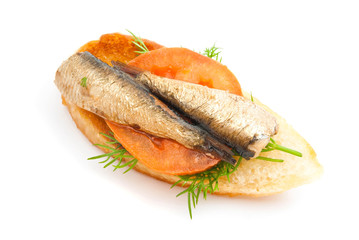 sandwich with sprats and tomato on white
