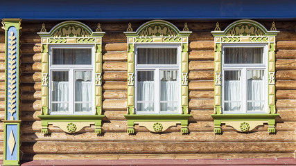 facade of Russian log houses with frames