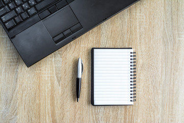 Wooden office desk with various accessories
