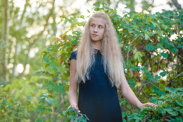 Young happy woman in green field.
