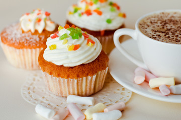 Beautiful coffee Cup with heart cupcake on white wooden background