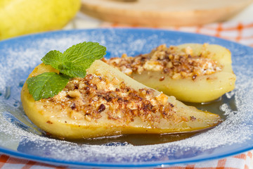 Pear baked with honey, curd cheese and walnut
