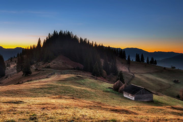 Carpathian Mountains. Morning in the mountains, the house on the hillside