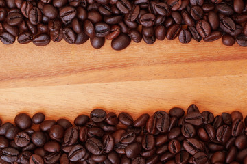 Coffee beans on wood background