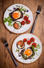 Fried eggs, salmon canape and  tomatoes
