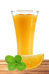 orange juice with slices of orange and mint in the glass on tabl