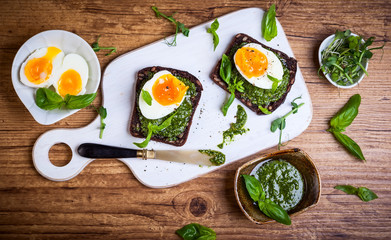 Boiled egg with pesto on toast