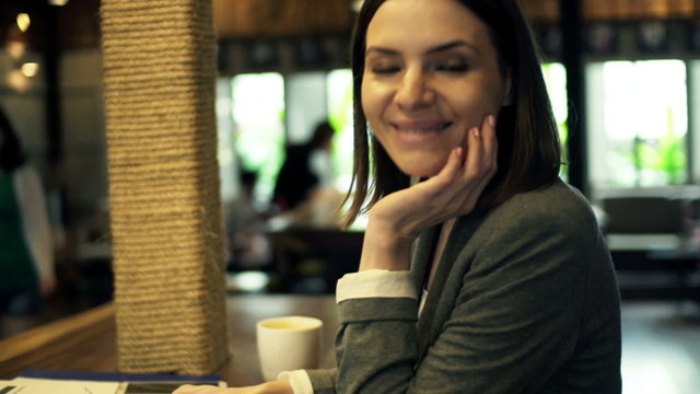 Portrait of beautiful, happy businesswoman with tablet computer in cafe HD
