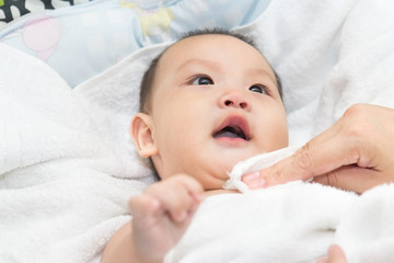 Newborn baby having a bath ,have fun in the bath time