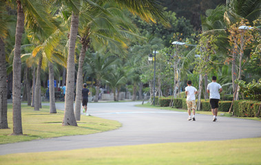 Obraz premium Man running in park at autumn morning. Healthy lifestyle concept
