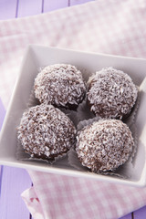 sweet and delicious chocolate balls with coconut flakes 