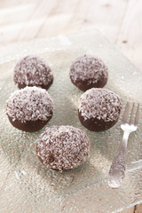 sweet and delicious chocolate balls with coconut flakes 