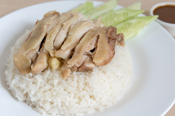 Thai food gourmet steamed chicken with rice , khao mun kai on wood background