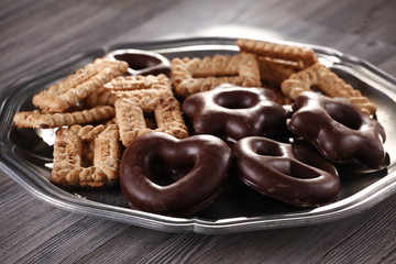 Mixed tasty cookies on a round plate 