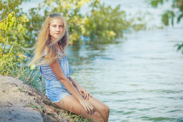 Obraz premium girl a park near the river.