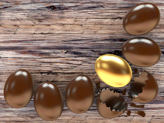 Chocolate eggs and one golden egg on a wooden background