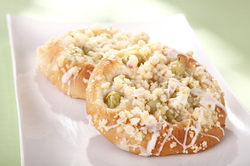 sweet and fresh rolls with rhubarb, green background 