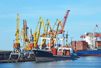 Bulk cargo ship under port crane bridge, Odessa, Ukraine