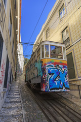 Fototapeta na wymiar Vintage elevator with graffiti on old street