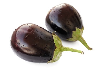 Two dark violet heirloom eggplants isolated
