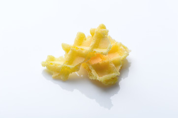 yellow slices of crispy waffles isolated on white background. sw