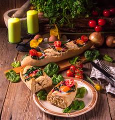 farmer baguette filled with egg, bacon and spinach