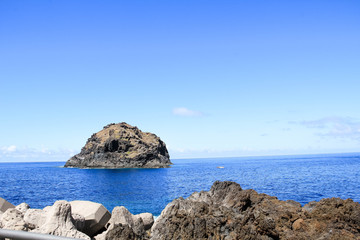 Fototapeta na wymiar Majestic volcanic rocks on the shore of the Atlantic Ocean, Tenerife, Spain. No people