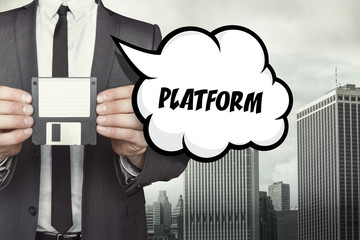 Platform text on speech bubble with businessman holding diskette