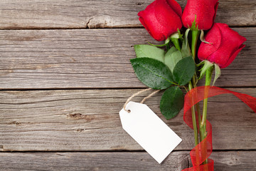 Valentine's day red roses over wood © Evgeny Karandaev