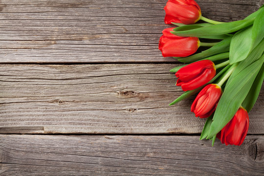 Valentine's day red tulips over wood - Powered by Adobe