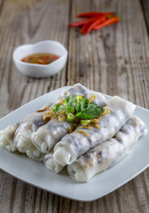 Vietnamese styled steamed rice noodle rolls with fish sauce and red pepper.