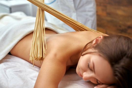 massage with bamboo sticks Stock Photo | Adobe Stock