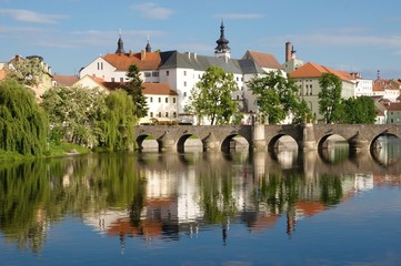 Fototapeta na wymiar Medieval Town Pisek and historic stone bridge over river Otava in the Southern Bohemia, Czech Republic
