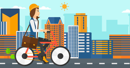 Obraz premium Woman cycling to work.