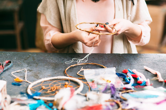master makes new  Dreamcatcher in art studio.