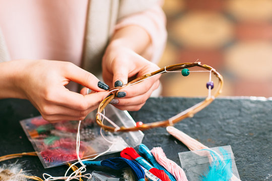 master makes new  Dreamcatcher in art studio.